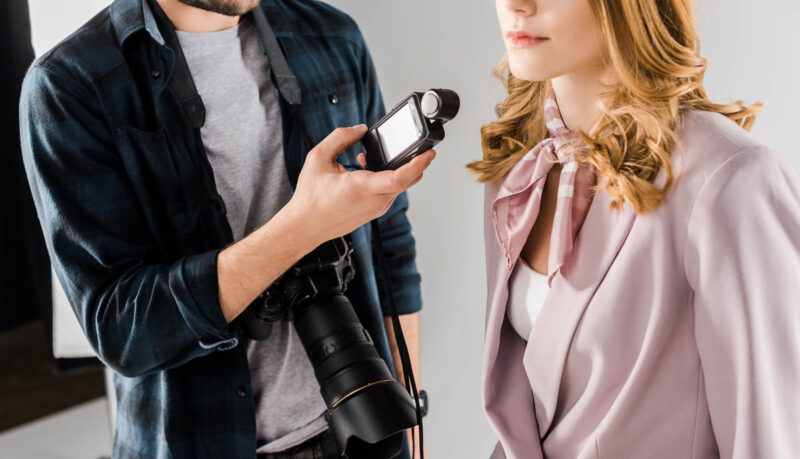 photographer using light meter