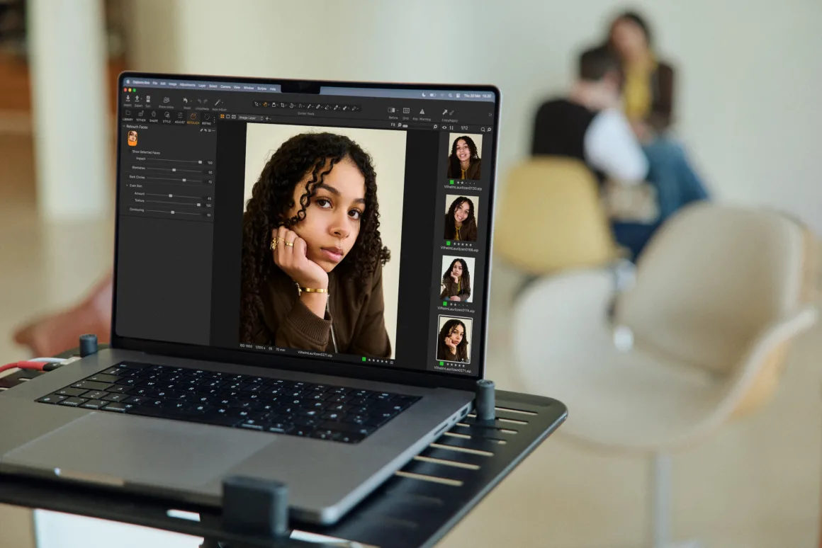 laptop with capture one sits in front of blurred portrait session